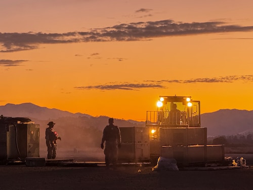 Airmen with the 821st Contingency Response Squadron work together to build tents during Exercise STORM CROW, at Fort Hunter-Liggett, California, June 24, 2024.