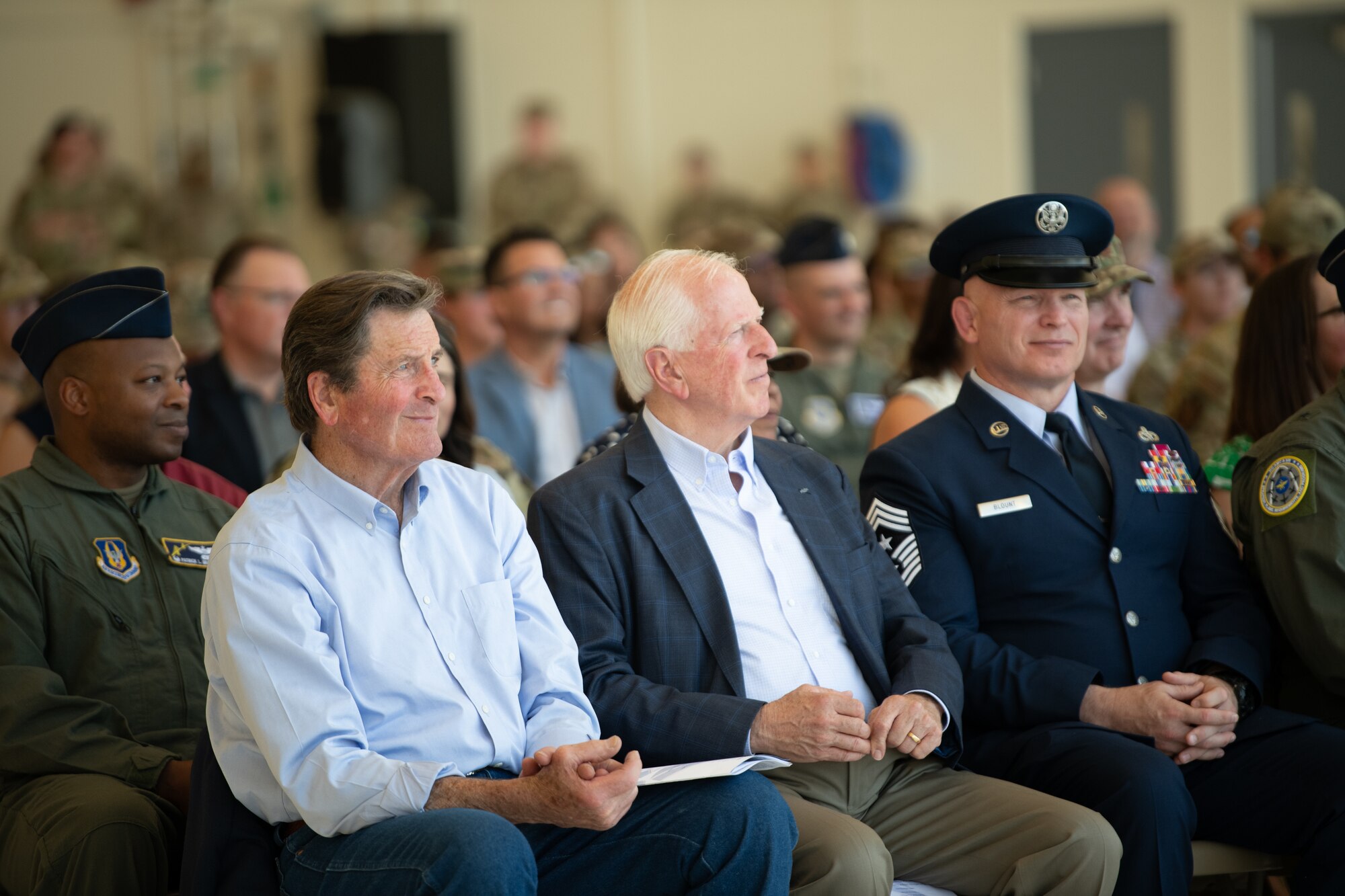 Attendees watch the change of command ceremony.