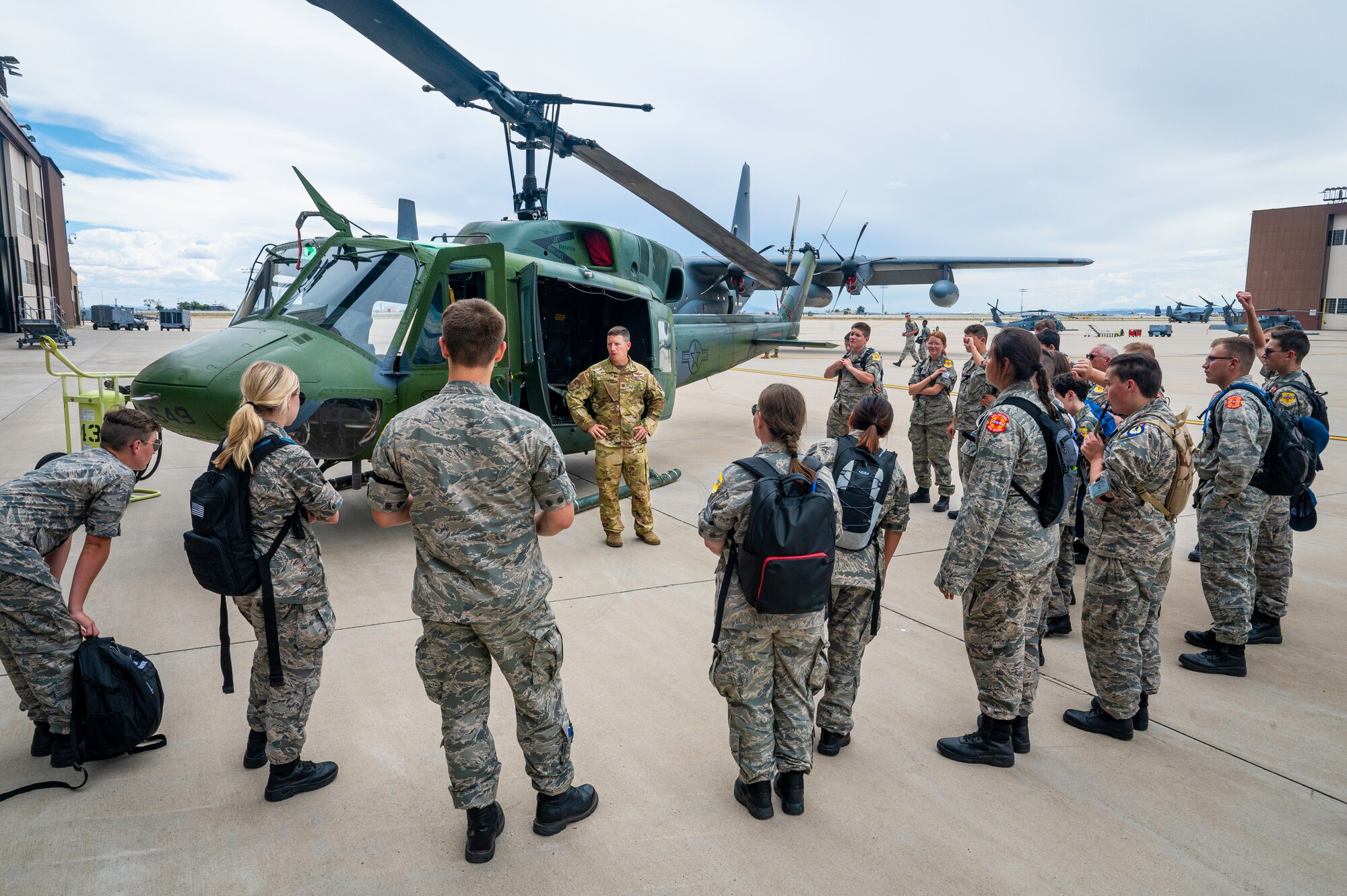 Students learn about helicopter from service member.