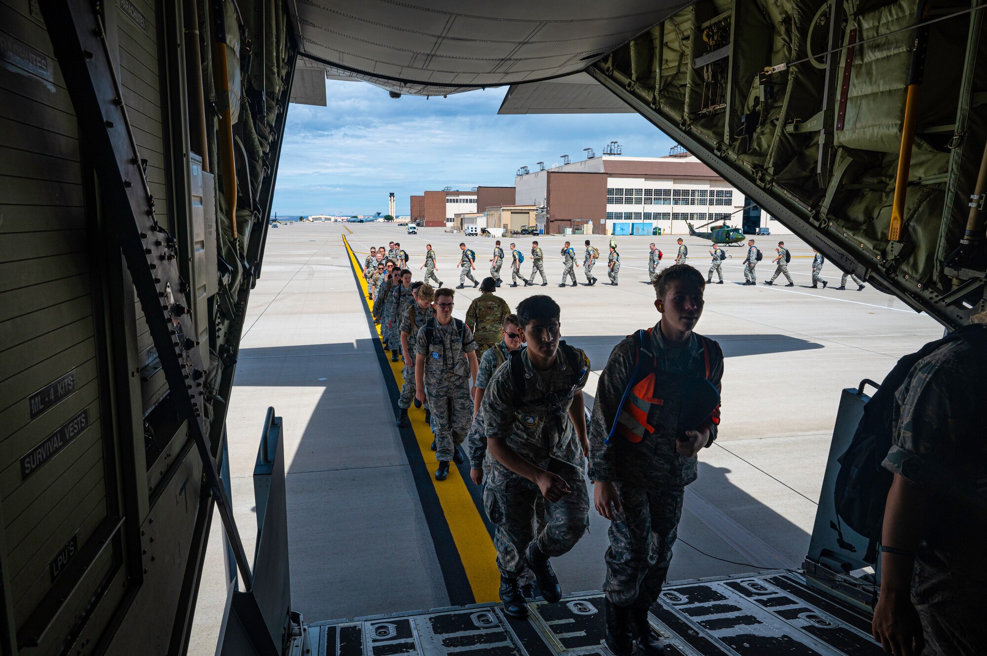 Students boarding an aircraft.