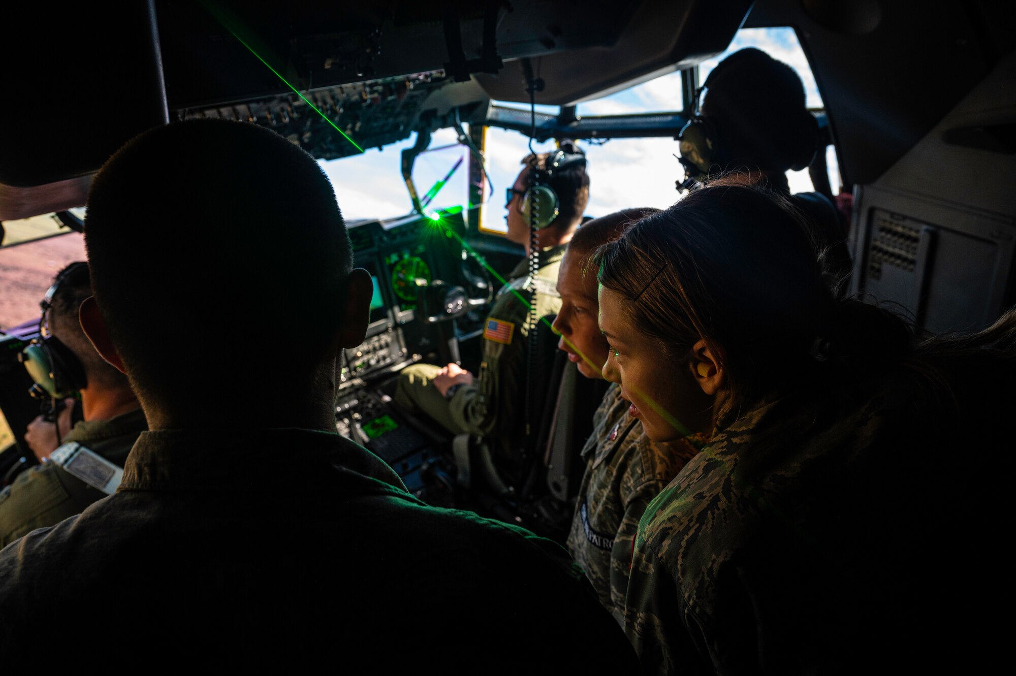Students look out window of aircraft.