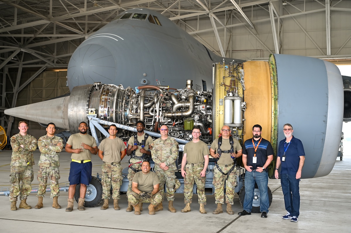 433rd Maintenance Group Reserve Citizen Airmen and civilian advisors pose for a group photo after the first removal of a General Electric F-138 jet engine from a C-5M Super Galaxy at the 433rd Airlift Wing on Joint Base San Antonio-Lackland, Texas June 28, 2024.