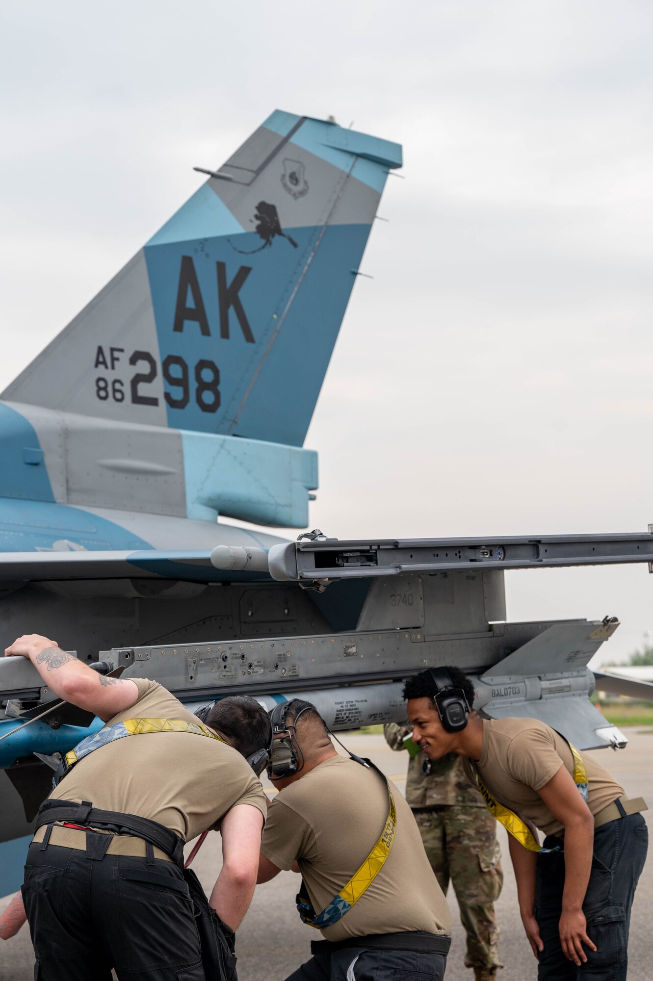 Airmen assigned to the 18th Fighter Generation Squadron inspect a piece of armament during a load competition at Eielson Air Force Base, Alaska, July 3, 2024.