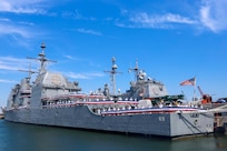 Sailors man the rails during the decommissioning ceremony of the guided-missile cruiser USS Vicksburg (CG 69), June 28,