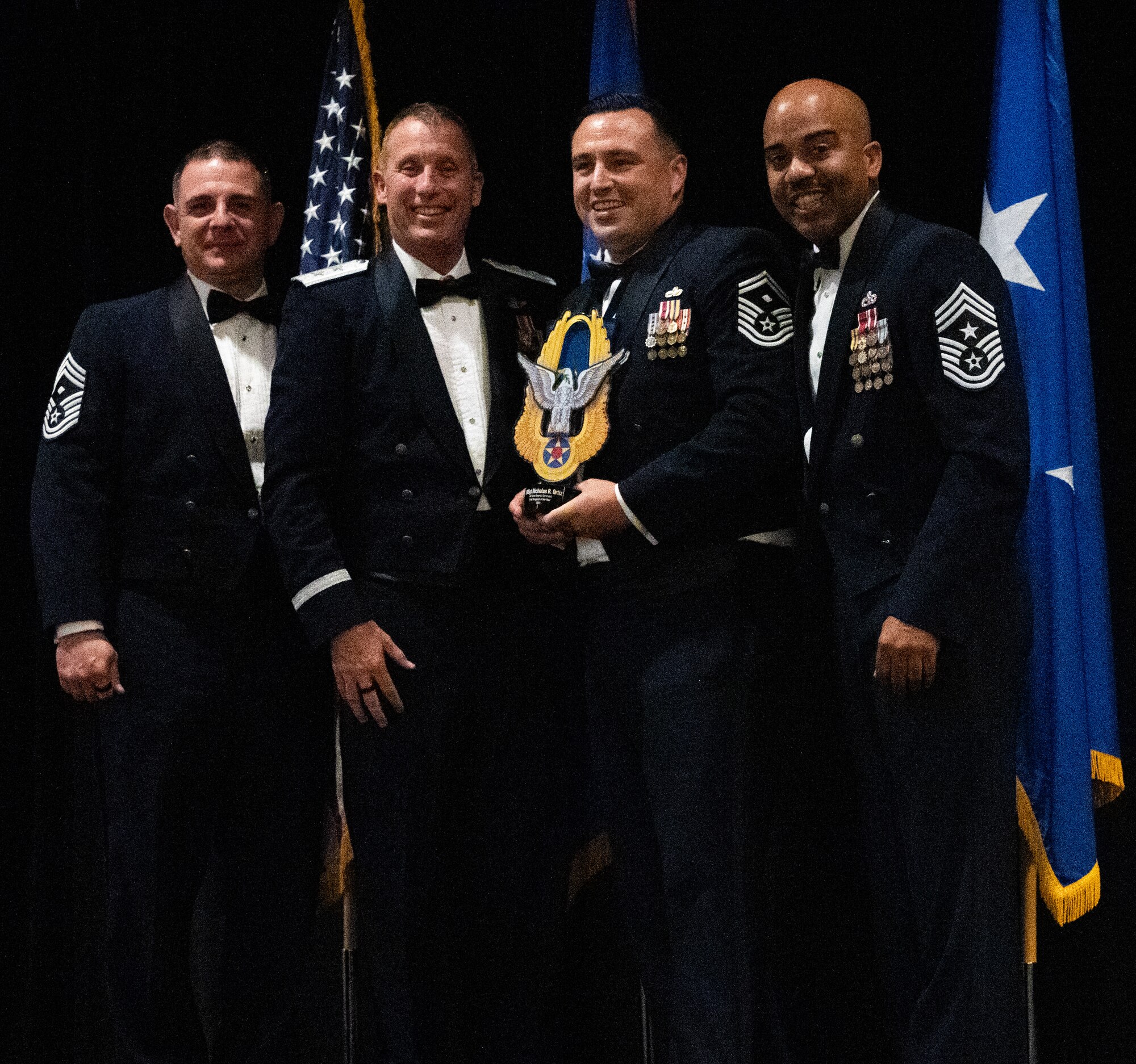 2024 AFRC First Sgt of the Year — SMSgt Nicholas Ortiz, HQ AFRC, center.