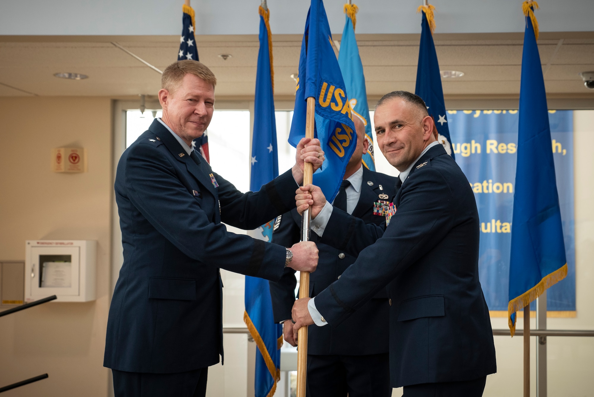 Col. (Dr.) Richard O. Speakman, right, assumes command of the United States Air Force School of Aerospace Medicine, or USAFSAM, in a formal change of command ceremony with 711th Human Performance Wing, or 711HPW, Commander Brig. Gen. (Dr.) Robert K. Bogart, left, at Wright-Patterson Air Force Base, Ohio, July 2, 2024. USAFSAM, the premier institute for education and worldwide consultation in Aerospace and Operational Medicine, is one of two mission units that comprises the Air Force Research Laboratory’s 711HPW. Prior to assuming command of USAFSAM, Speakman served as the commander and Military Treatment Facility director of the 71st Medical Group at Vance Air Force Base, Oklahoma, where he oversaw the execution of a $6.1 million budget and provision of health care and preventive health services for the 71st Flying Training Wing, Undergraduate Pilot Training students and 3,900 Vance Air Force Base community beneficiaries. (U.S. Air Force photo / Rick Eldridge)
