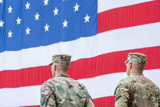  Uniformed members stand at attention during the playing of the Space Force song.