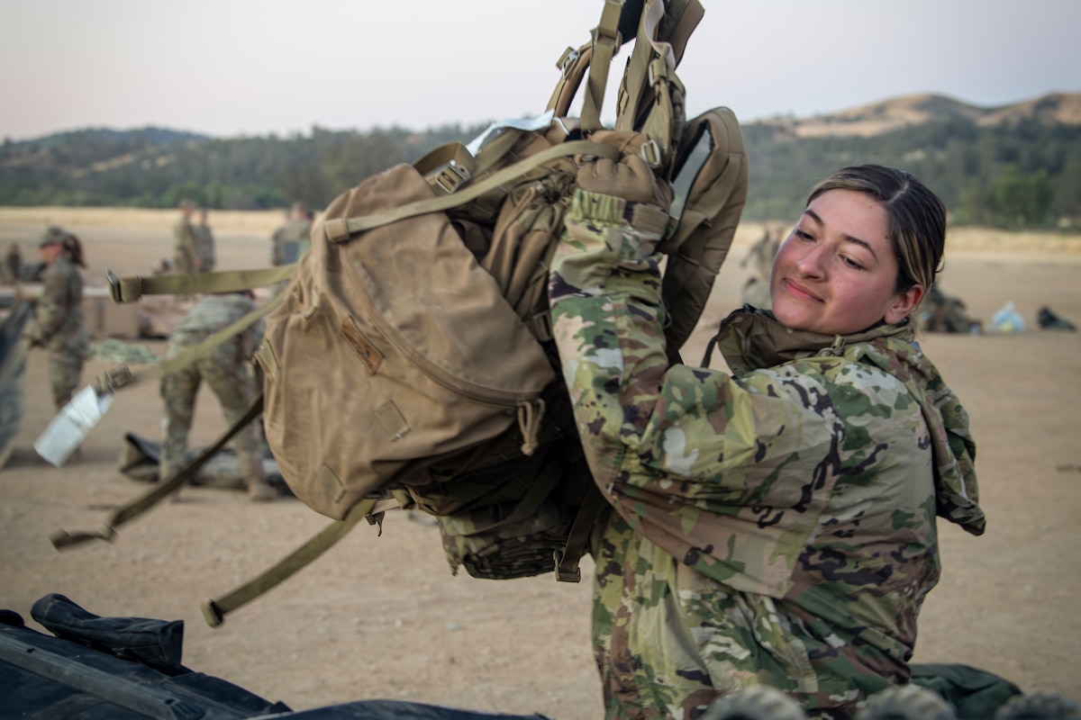 Senior Airman Brittney Briones, 821st Contingency Response Squadron aerial porter specialist, loads a baggage pallet during Exercise STORM CROW, at Fort Hunter-Liggett, California, June 28, 2024.