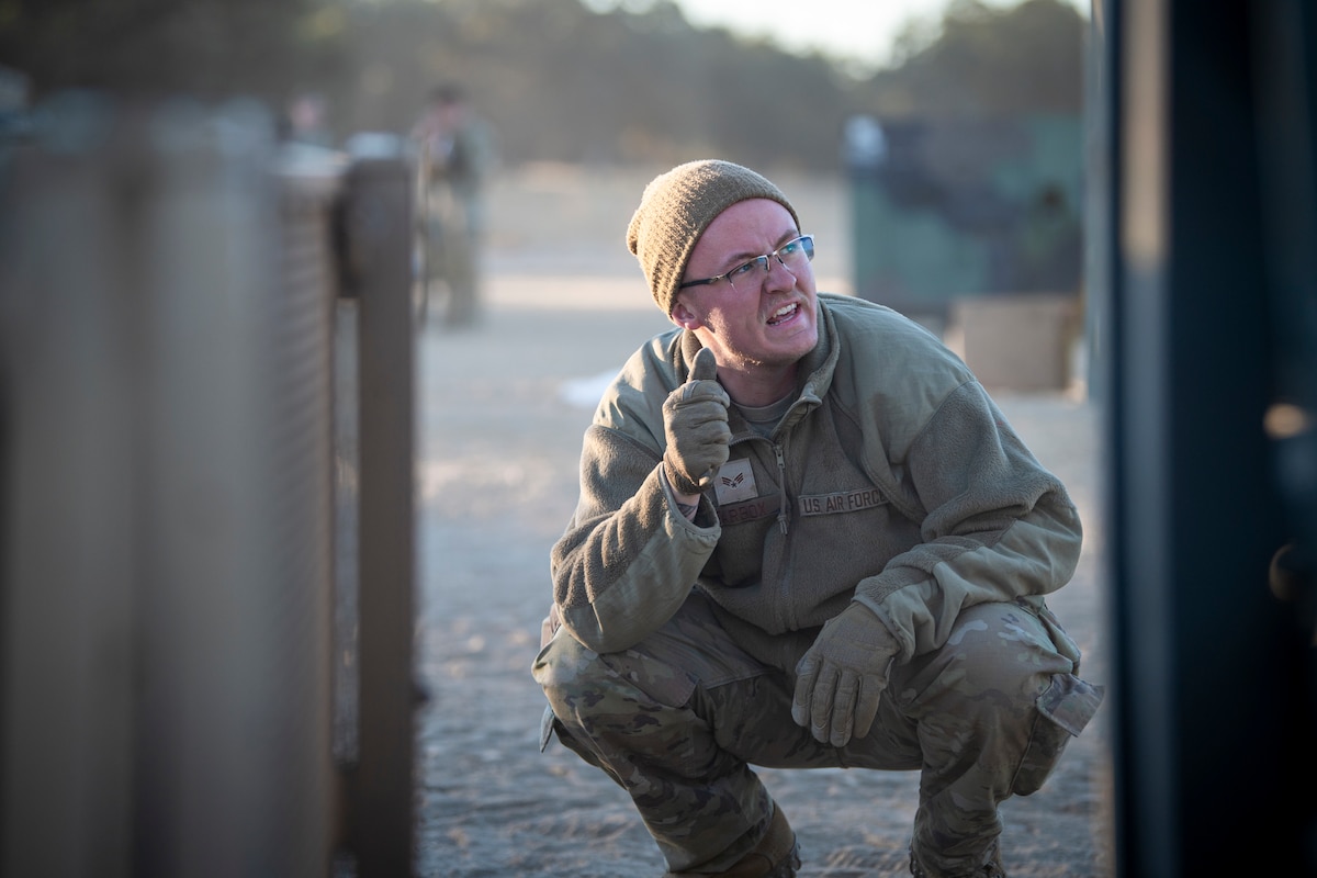 Senior Airman Trevor Tarbox, 821st Contingency Response Squadron aerial porter specialist, marshals a forklift during Exercise STORM CROW, at Fort Hunter-Liggett, California, June 28, 2024.