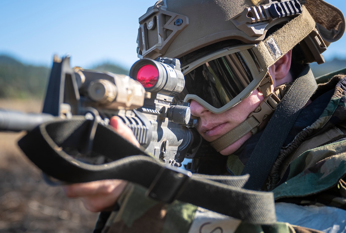 U.S. Air Force Staff Sgt. Miles Winford, 821st Contingency Response Squadron weather technician, takes aim down his M-4 carbine scope during Exercise STORM CROW, at Fort Hunter-Liggett, California, June 26, 2024.