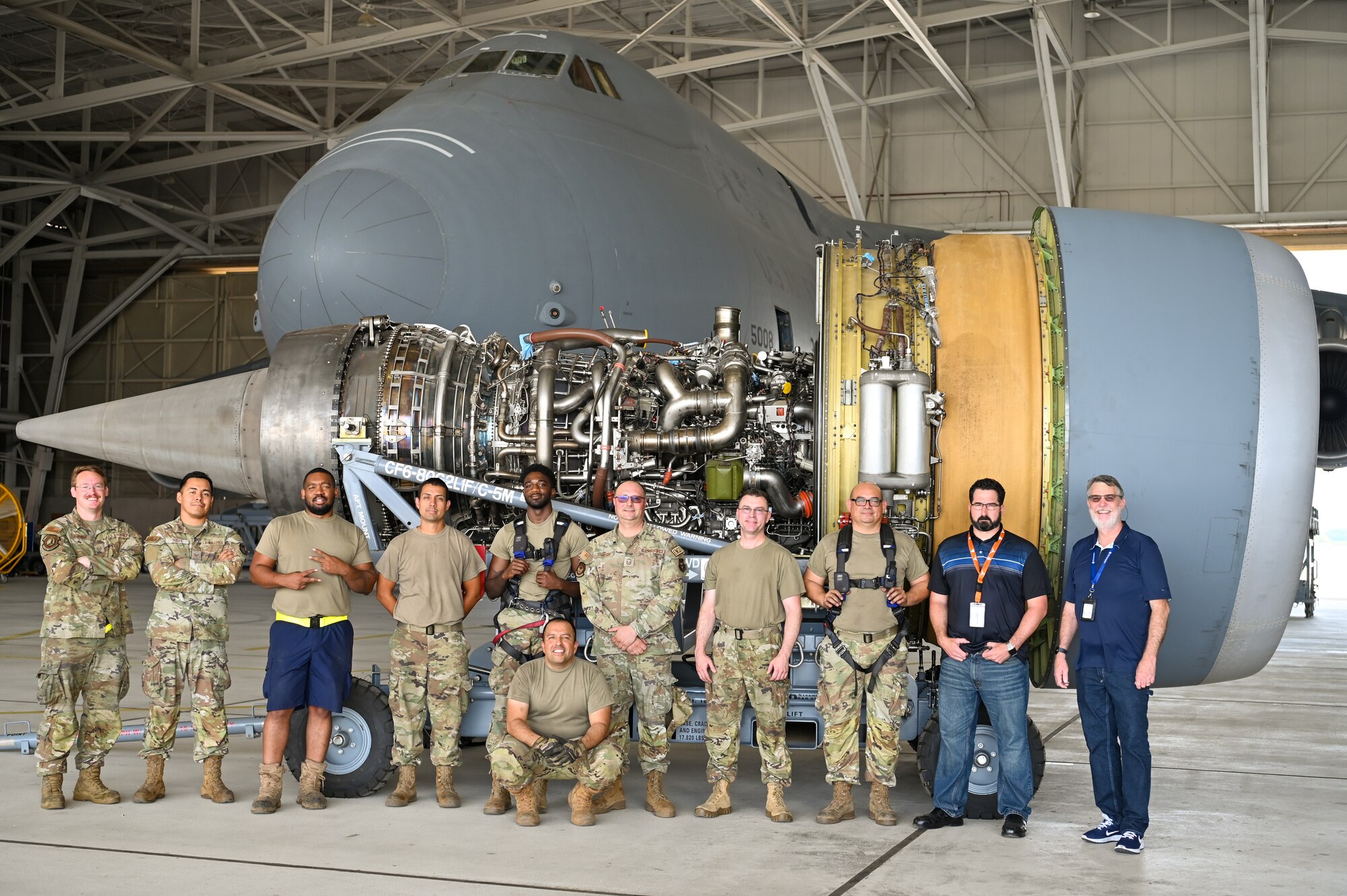433rd Maintenance Group Reserve Citizen Airmen and civilian advisors pose for a group photo after the first removal of a General Electric F-138 jet engine from a C-5M Super Galaxy at the 433rd Airlift Wing on Joint Base San Antonio-Lackland, Texas June 28, 2024.