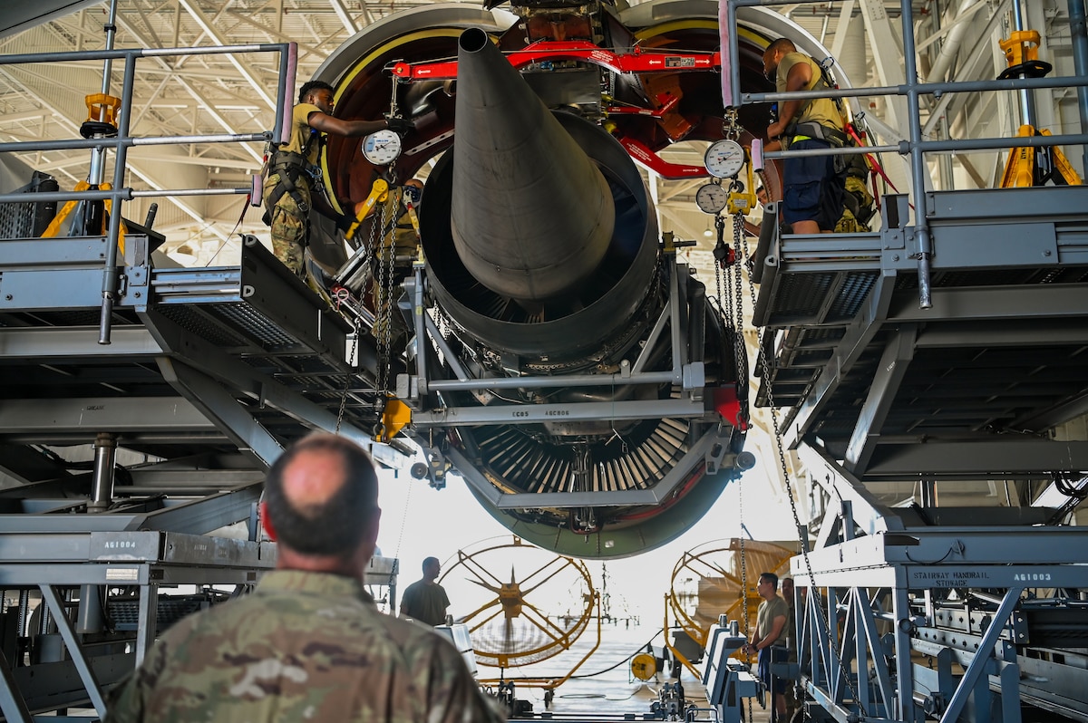 Senior Master Sgt. Sean Preston, 433rd Maintenance Squadron propulsion flight chief, monitors the decent of a General Electric F-138 jet engine from a C-5M Super Galaxy at Joint Base San Antonio-Lackland, Texas June 28, 2024.
