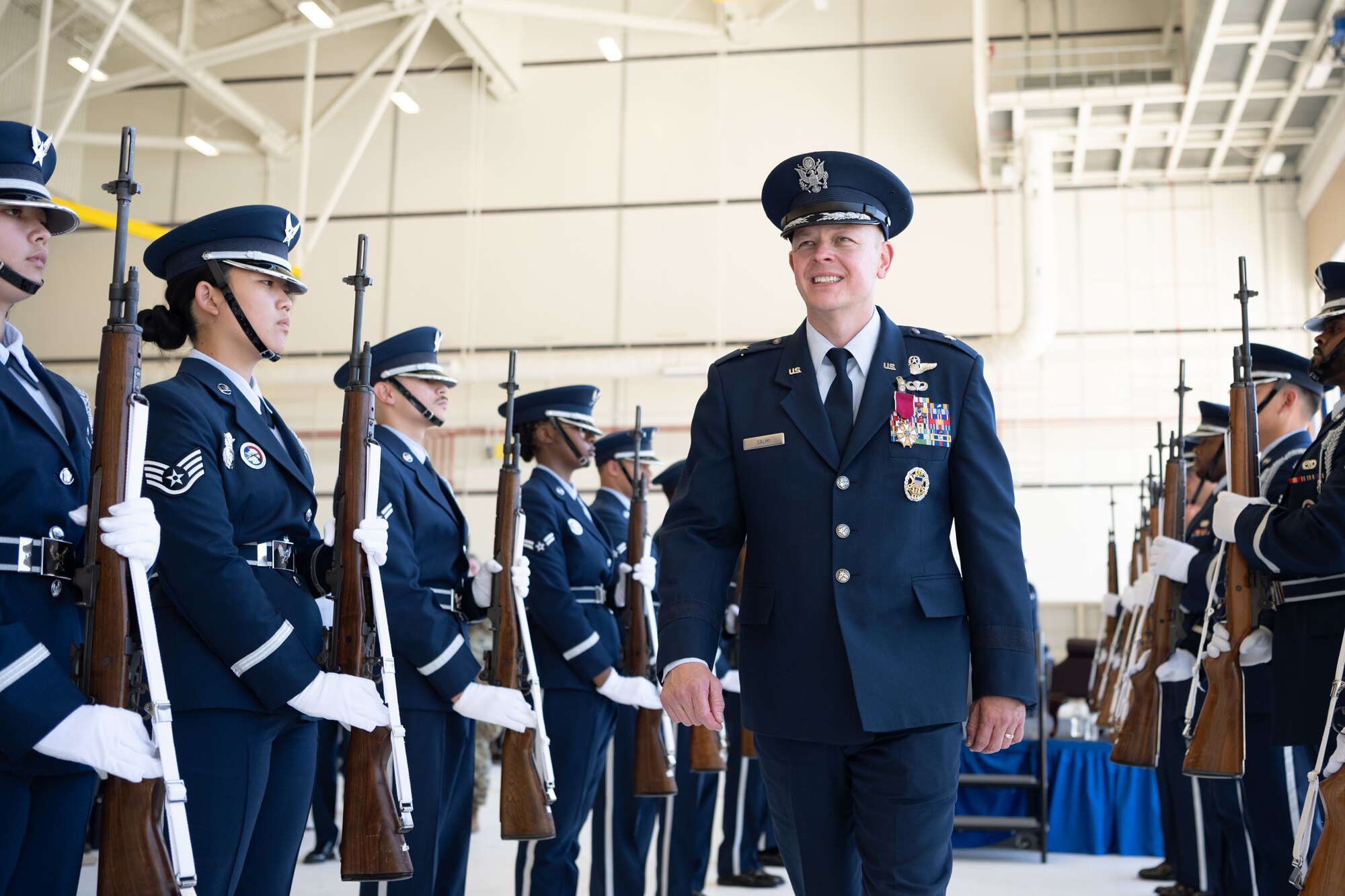 U.S. Air Force Brig. Gen. Derek Salmi exits the stage.