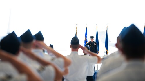 U.S. Air Force Col. Jay Johnson renders his first salute to Team Travis.