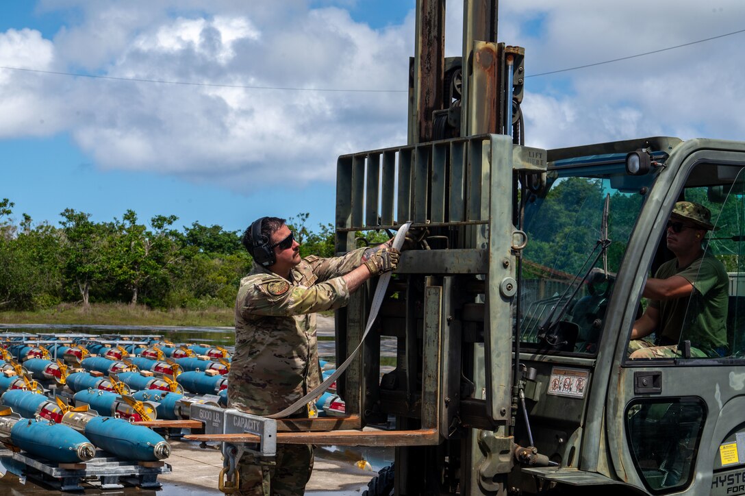 U.S. Air Force Staff Sgt. Devin Evangelista, 28th Aircraft Maintenance Squadron load crew team member prepares to load a joint direct attack munition GBU-38s onto a forklift at Andersen Air Force Base, Guam, June 14, 2024, in support of a Bomber Task Force mission. Our vision of the Indo-Pacific is a free and open region comprised of nations that adhere to the international rules-based order. (U.S. Air Force photo by Airman 1st Class Audree Campbell)
