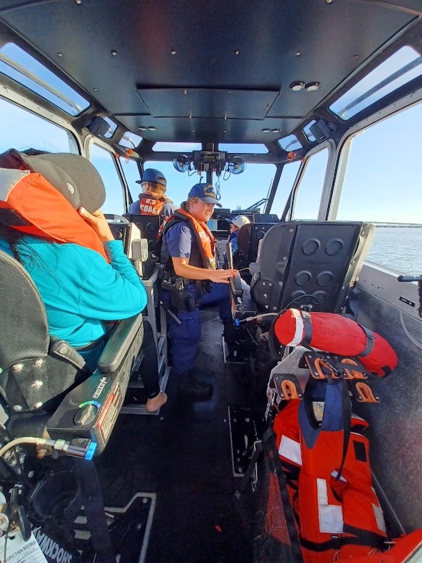 A 45-foot Response Boat–Medium crew from Coast Guard Station Freeport, surveys a capsized vessel near Galveston, Texas, July 4, 2024. After the crew rescued the people in the water, they transported them to the Galveston Bait Shop. (U.S. Coast Guard photo Courtesy Station Galveston)