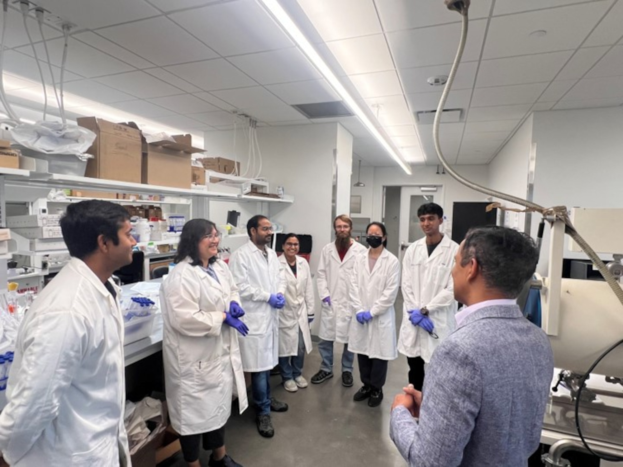 Dr. Sohini Bhattacharyya, second from left, a postdoctoral research associate at Rice University’s Department of Materials Science and NanoEngineering, discusses research activity on the processing approaches for two-dimensional nano-materials growth with researchers and students May 9, 2024, at the new International Research Innovation in Nanotechnology, or RISING Center at Rice University in Houston, Texas. The RISING Center, which opened May 9, 2024, is part of collaborative effort between the Air Force Research Laboratory, Rice University, India’s Defense Research Development Organization and the Indian Institute of Technology that seeks to strengthen U.S. scientific and manufacturing ties with India, as well as increase availability of rare nanomaterials technology. (Courtesy photo / Becca Zietler)