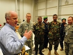 Col. Thomas x. Hammes (Ret.), Senior Research Fellow at the National Strategic Studies, National Defense University, right, participates in a discussion with service members from U.S. Air Force and the Afghan National Army Air Corps about the development of the Air Corps over the last few years.