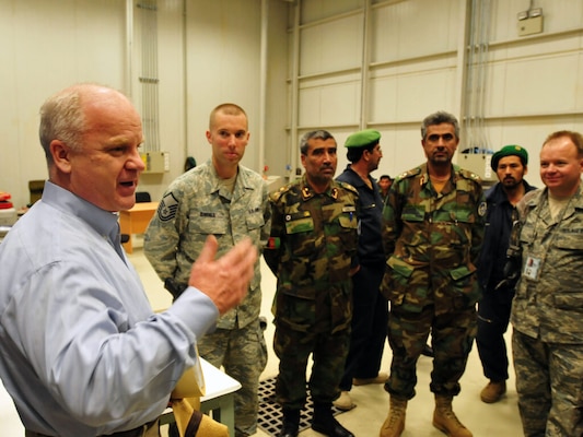 Col. Thomas x. Hammes (Ret.), Senior Research Fellow at the National Strategic Studies, National Defense University, right, participates in a discussion with service members from U.S. Air Force and the Afghan National Army Air Corps about the development of the Air Corps over the last few years.