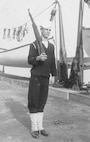 BM1c Albert A. Kelsch, on board MUSKEGET in a signed photo he sent to his mother sometime before August 1942.