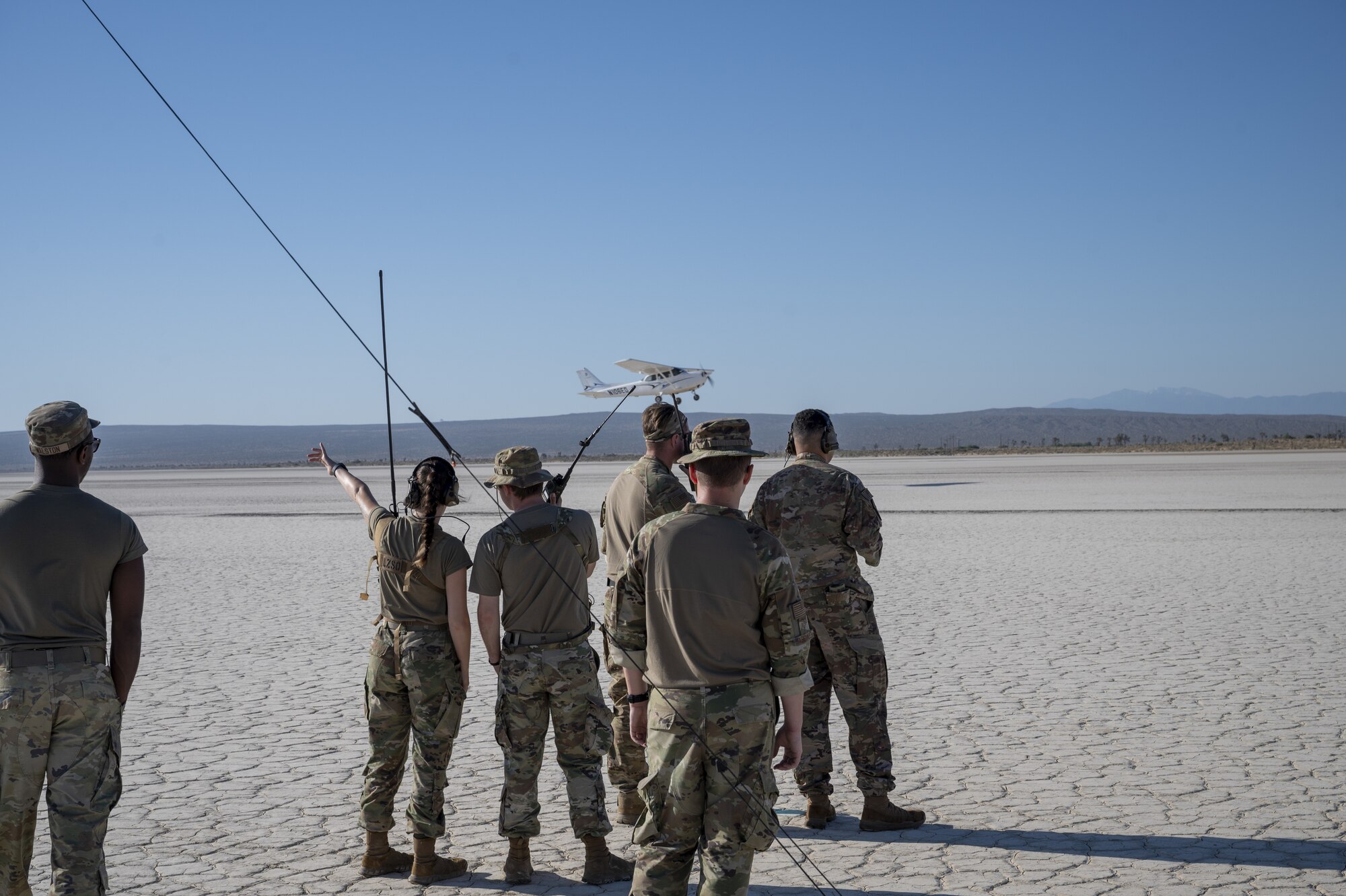 Airmen from the 9th Operations Support Squadron from Beale Air Force Base trains air traffic operations in a forward-deployed location with two Cessna airplanes from the Edwards Aero Club on Rodgers Dry Lake at Edwards AFB, California, June 6. Rogers Dry Lake continues to be used by Edwards AFB to provide training opportunities in austere environments and as an emergency landing site for both air and spacecraft.