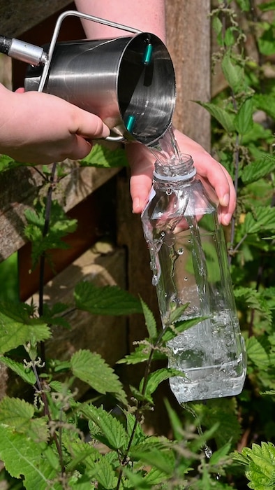 Stephanie Poole collects water samples at RAF Lakenheath