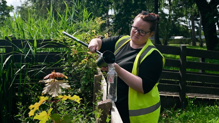 Stephanie Poole collects water samples at RAF Lakenheath