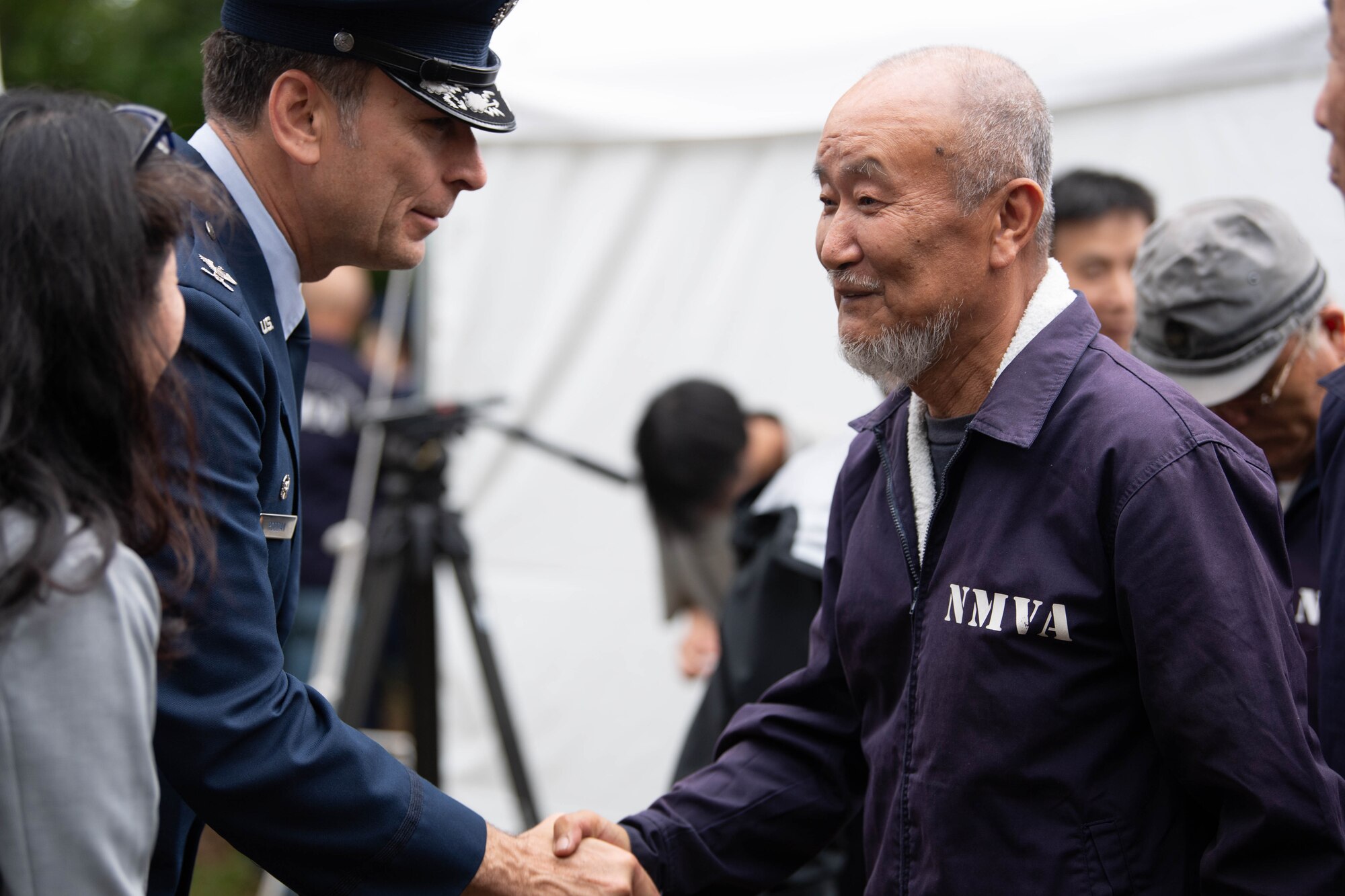Two people shaking hands.