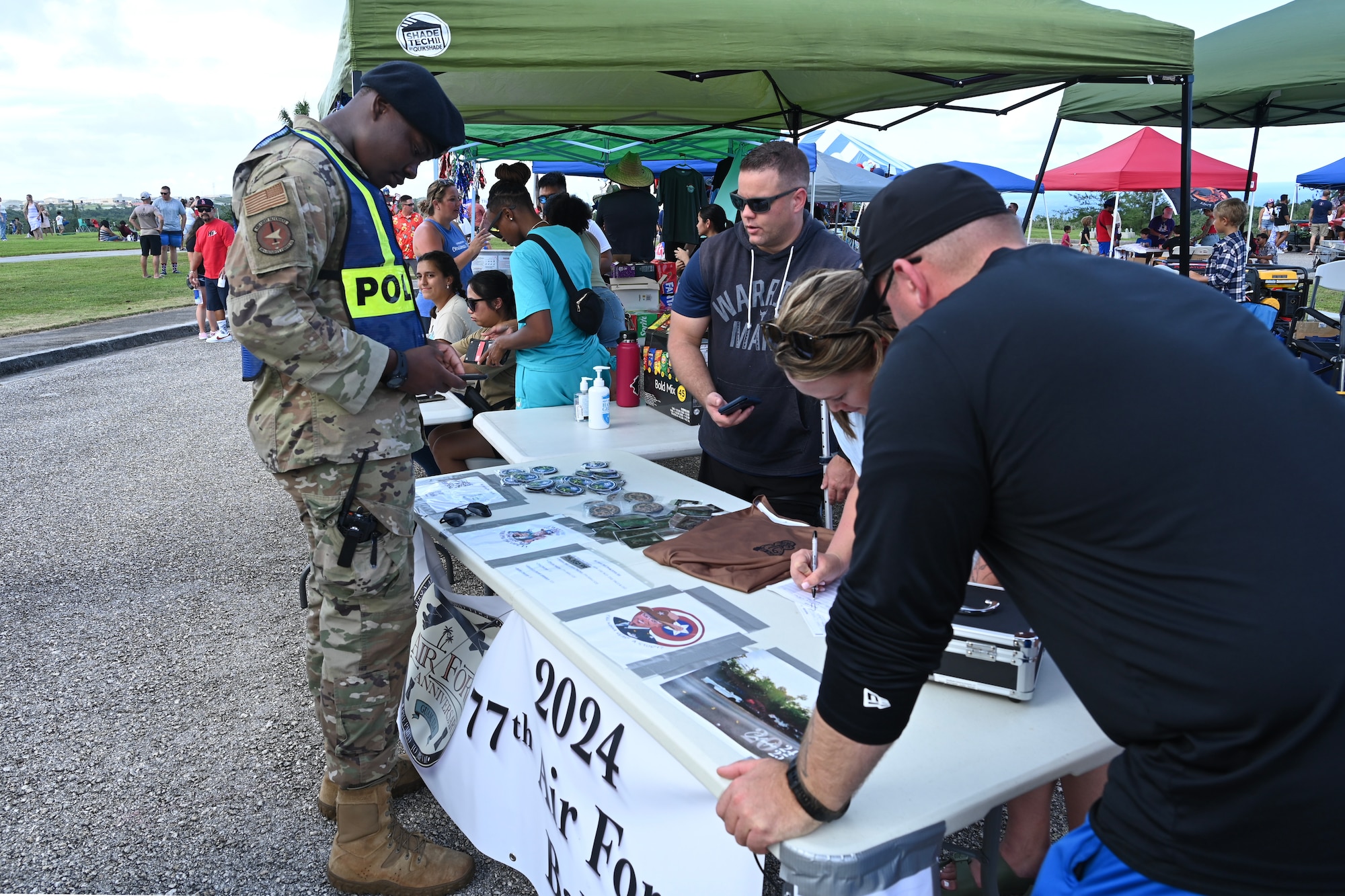 A 36th Security Forces Squadron member observes the Air Force Ball Committee's items.