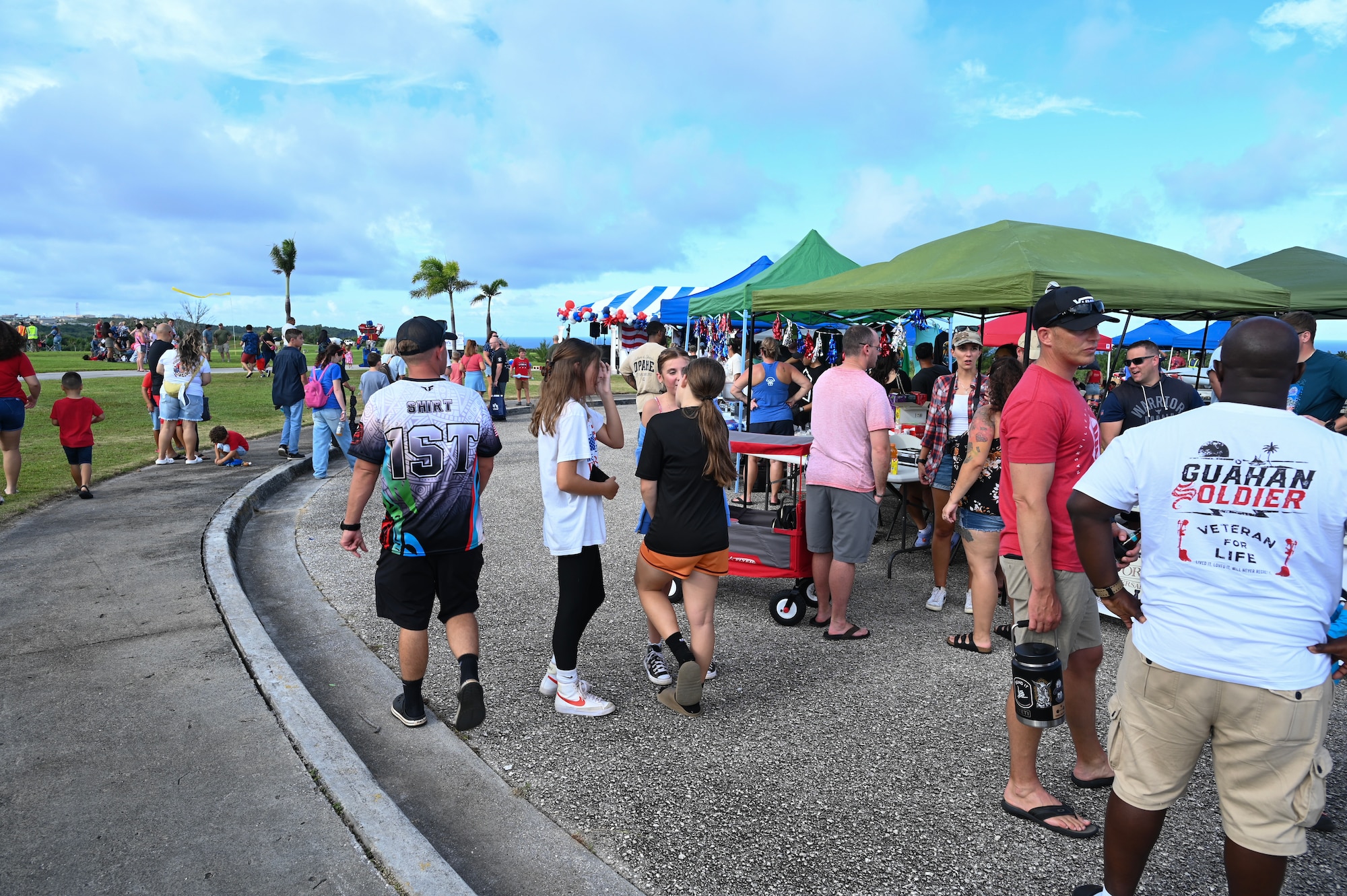 Military families converse and interact with vendors and fellow residents during Freedom Fest