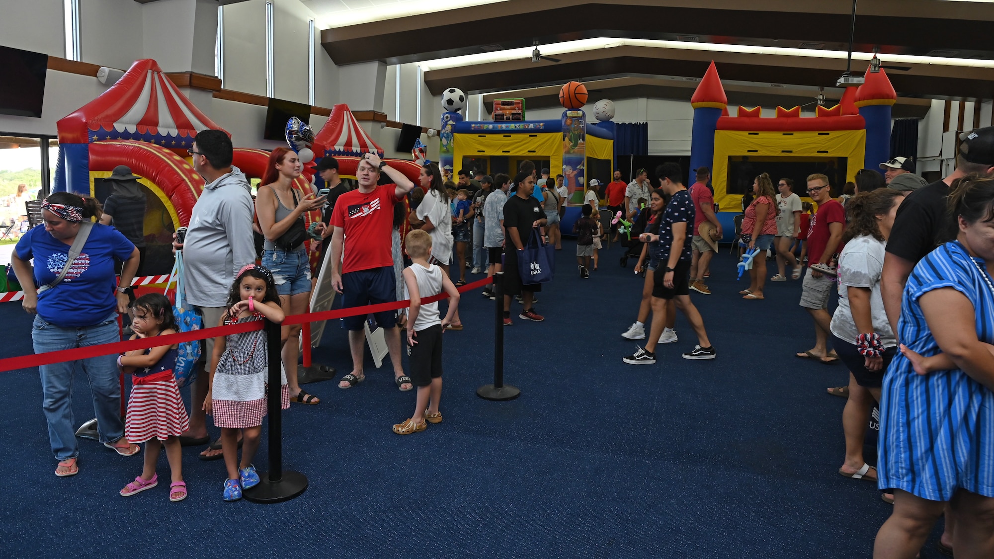 Military residents interact and converse with each other in the kid zone.
