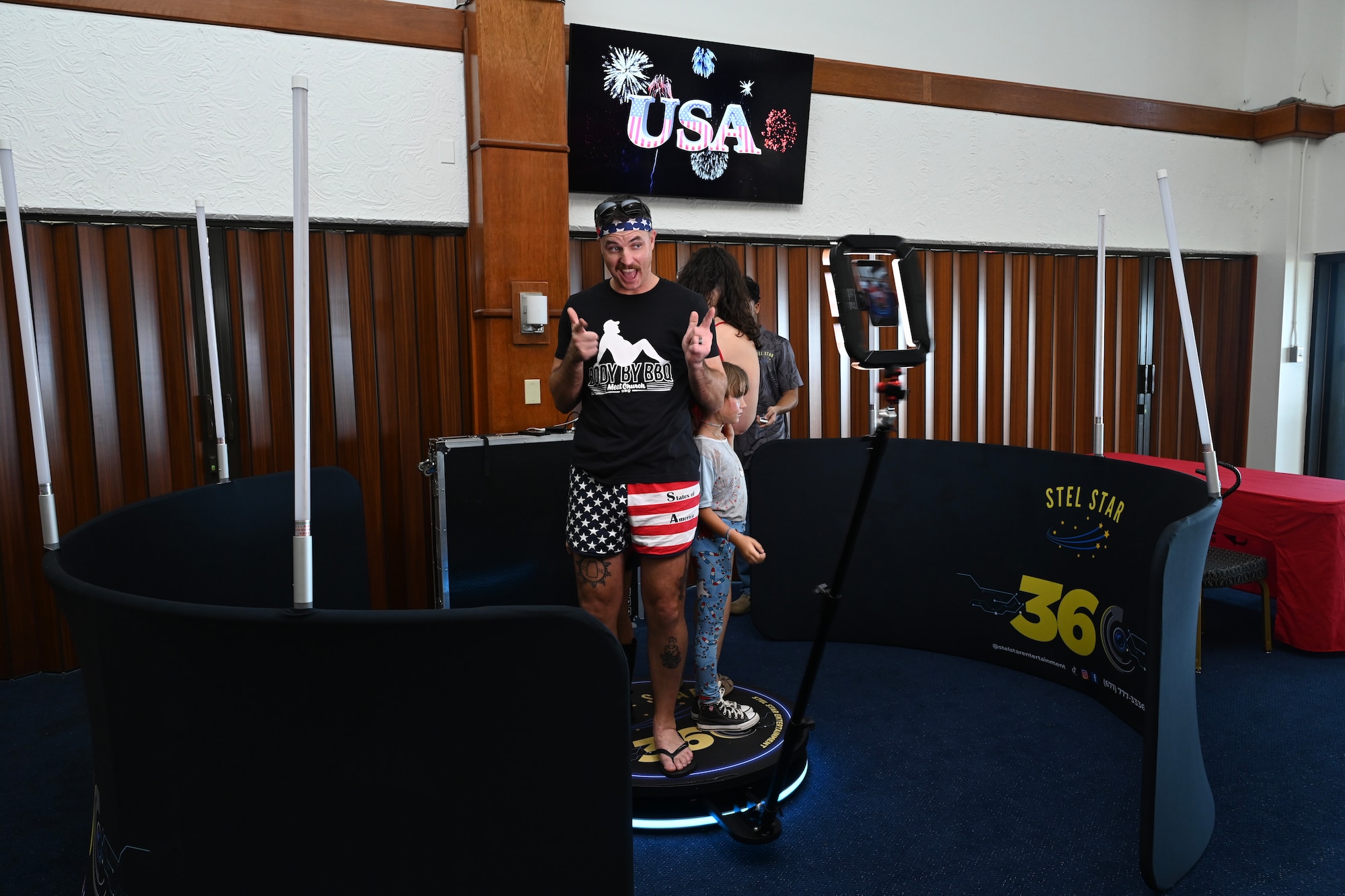 A military family takes pose for a 360 camera booth video