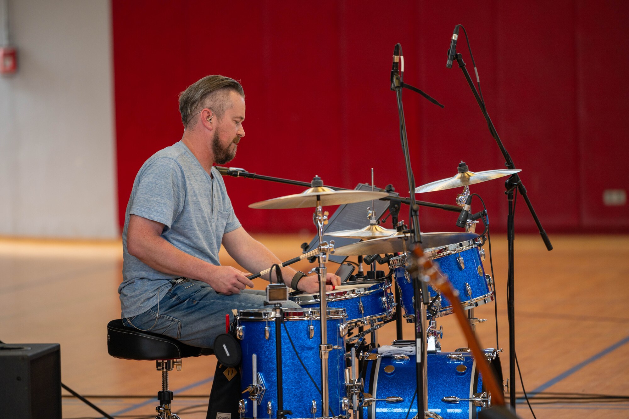Musician plays the drums.