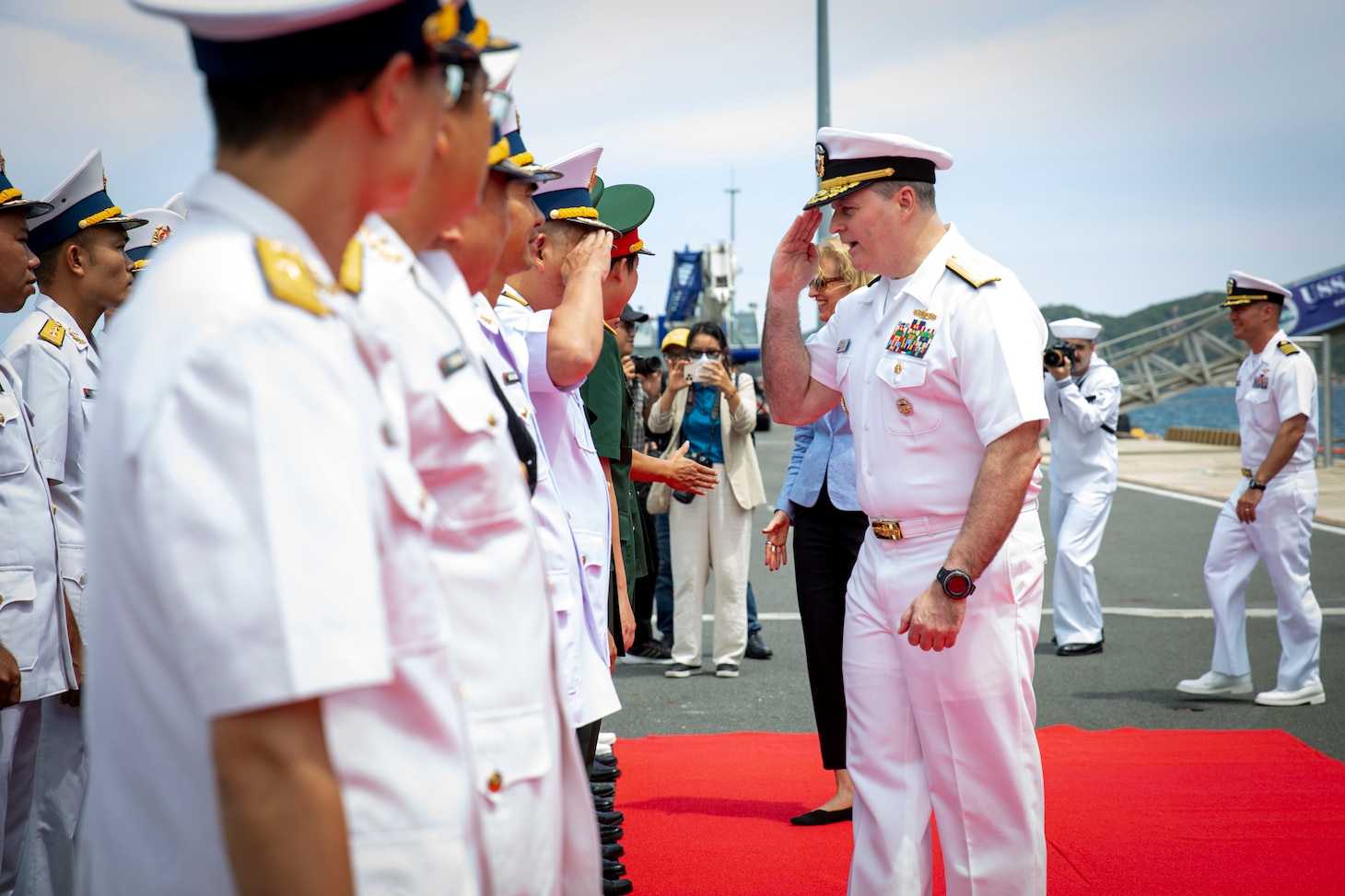 U.S. Navy Vice Adm. Fred Kacher, commander, U.S. 7th Fleet, greets Vietnam People's Navy Sailors on the pier beside the 7th Fleet flagship USS Blue Ridge (LCC 19) following the ship’s arrival to Cam Ranh International Port, Vietnam, July 8, 2024.