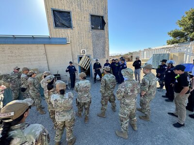 Hawaii Air National Guard Airmen from the 154th Medical Group Detachment 1 and urban search and rescue teams from across the United States are briefed June 5, 2024, at Livermore-Pleasanton Fire Training Center in Livermore, Calif. The briefing, conducted during the FEMA Urban Search and Rescue Medical Specialist Course, covered critical strategies for effective disaster response and coordination.