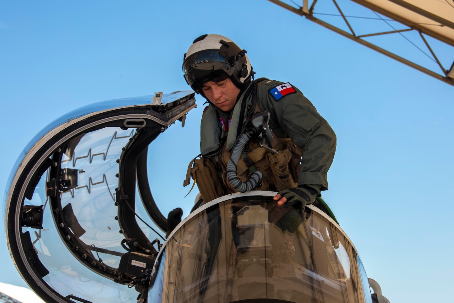 EL CENTRO, Calif. (July 19, 2023) Lt. J.g. Milo Sawczyn, assigned to the El Centro strike training detachment, enters the cockpit of a T-45C Goshawk jet aircraft on the flight line onboard Naval Air Facility (NAF) El Centro, Calif. July 19, 2023. NAF El Centro supports combat training and readiness of the Warfighter. This includes air operations support to operational fleet and training squadrons as well as squadrons from other services (USMC, USA, USAF) and Allies. (U.S. Navy photo by Mass Communication Specialist 3rd Class Aleksandr Freutel)