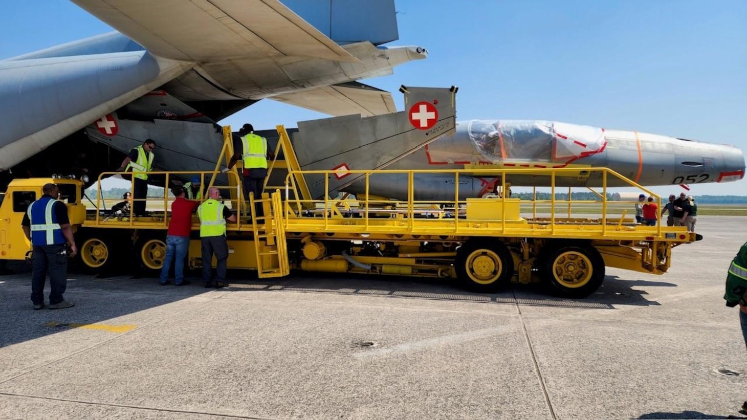 The first of 22 repatriated Swiss F-5 Tiger II aircraft arrived at the Tactical Air Support facility at Cecil Field in Jacksonville, Florida, March 21 for the second phase of the Avionics Reconfiguration and Tactical/Modernization for Inventory Standardization (ARTEMIS) program, ferried by a U.S. Marine Corps C-130J from Marine Aerial Refueler Transport Squadron (VMGR) 234.