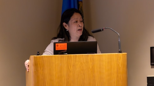Woman speaking at podium