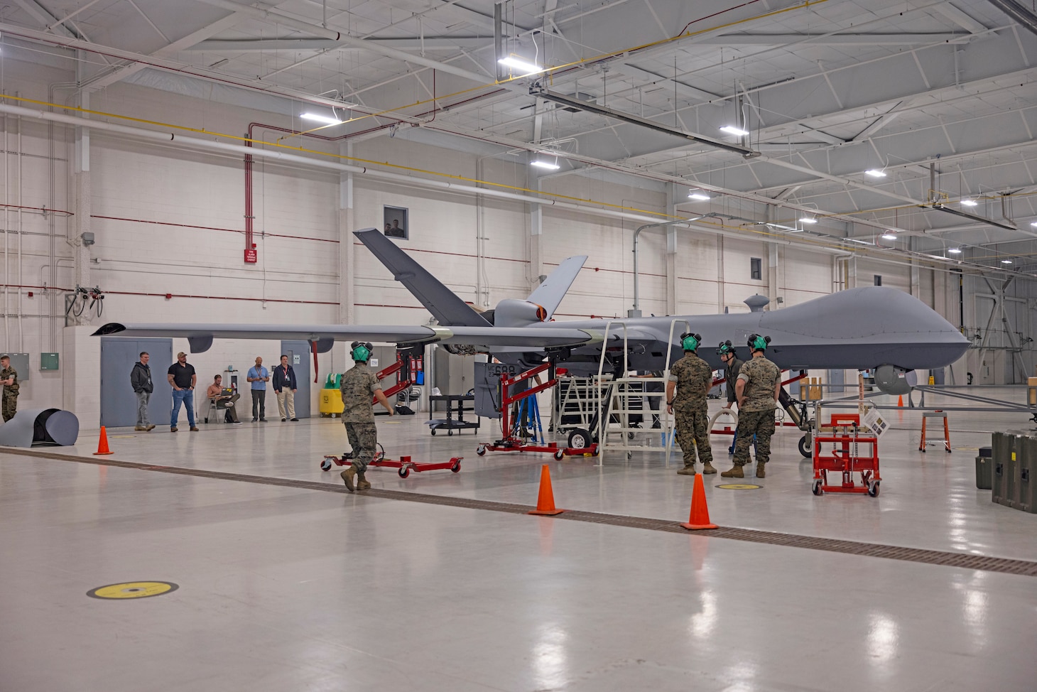 U.S. Marines with Marine Unmanned Aerial Vehicle Training Squadron (VMUT) 2 conduct familiarization training with an MQ-9A Reaper unmanned aircraft at Marine Corps Air Station Cherry Point, North Carolina, April 11, 2024. Marines with VMUT-2 worked alongside civilian contractors to conduct familiarization training with VMUT-2’s first delivered and assembled MQ-9A Reaper unmanned aircraft. VMUT-2 will serve as the Marine Corps MQ-9A Reaper Fleet Replacement Squadron, whose primary mission is to train 7318 unmanned aerial systems officers and 8022 enlisted sensor operators.