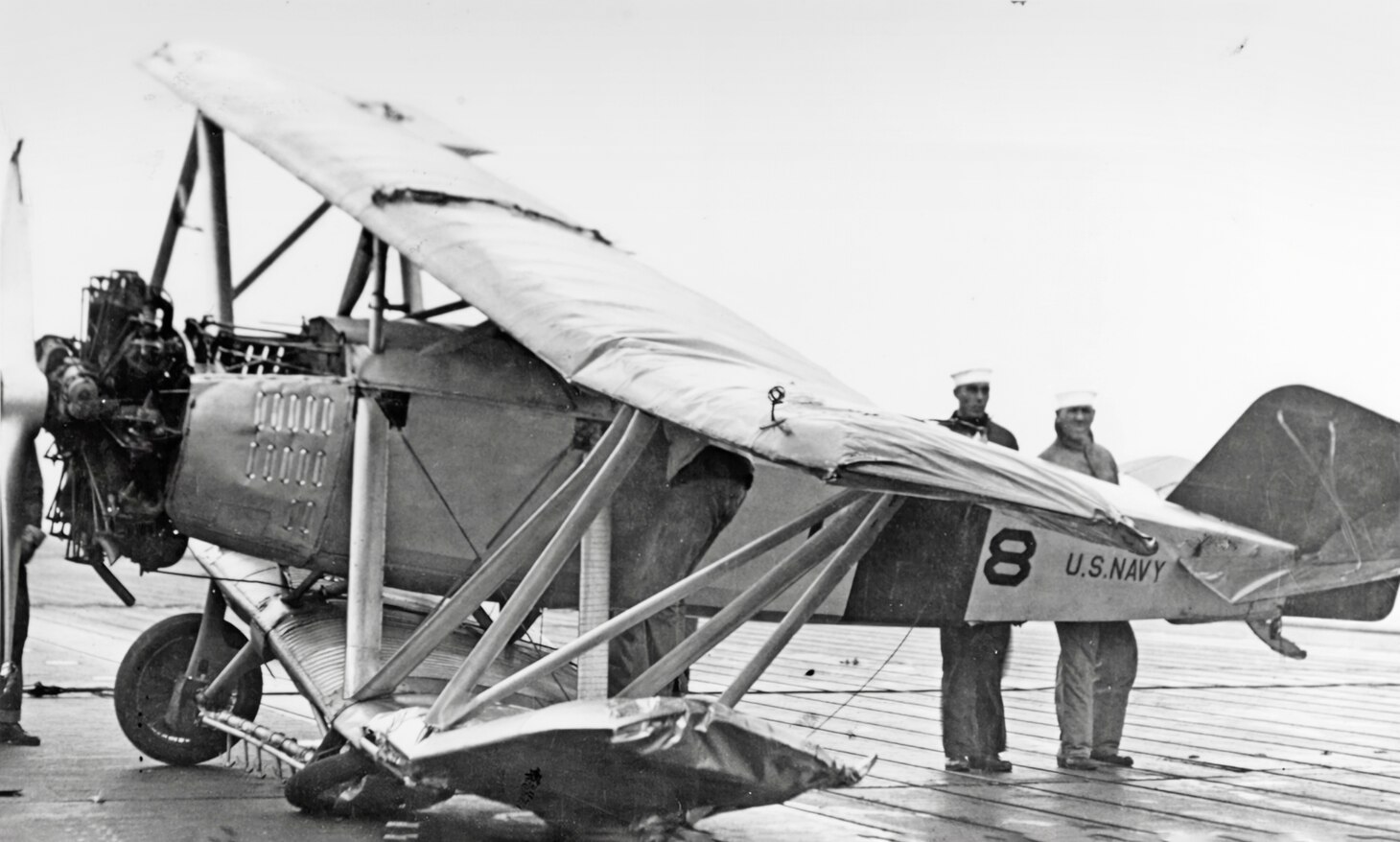 A Curtiss TS-1 fighter of Fighter Squadron (VF) 1 crashed on the Langley’s flight deck in 1924. Originally designated as a TS or “turret scout,” the TS-1 was originally designed to fly from platforms on the gun turrets of the various battleships of the 1920s. However, they were never used in that capacity. Indeed, the best that can be said of the little fighter, which was also designed to fly in a floatplane configuration, was it did give early American carrier aviators their initial experience operating from carriers.