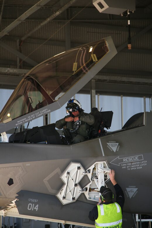 U.S. Marine Corps Maj. John Rose, an F-35B Lightning II pilot and the executive officer of Marine Fighter Attack Squadron (VMFA) 214, Marine Aircraft Group 13, 3rd Marine Aircraft Wing, debarks from a Royal Australian Air Force F-35A Lightning II aircraft assigned to the RAAF No. 75 Squadron at RAAF Base Tindal, Northern Territory, Australia, June 13, 2024. Leaders with VMFA-214, a USMC F-35B squadron, flew the RAAF F-35A during bilateral training, exhibiting interchangeability between RAAF and U.S. Marine aviation. VMFA-214 deployed more than 200 Marines and eight F-35B Lightning II aircraft from Marine Corps Air Station Yuma, Arizona, to RAAF Base Tindal, Australia, to conduct bilateral training with the RAAF No. 3 Squadron and No. 75 Squadron. (U.S. Marine Corps photo by Cpl. Nicholas Johnson)