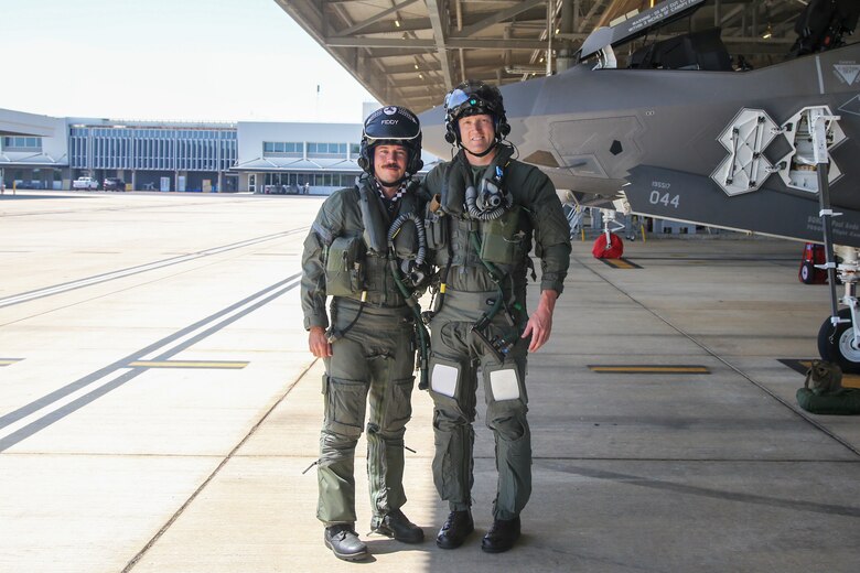 U.S. Marine Corps Lt. Col. Robert Guyette,right, an F-35B Lightning II pilot and commanding officer of Marine Fighter Attack Squadron (VMFA) 214, Marine Aircraft Group 13, 3rd Marine Aircraft Wing, and Royal Australian Air Force Wing Commander Andrew Nelson, wing commander of RAAF No. 75 squadron, take a photo before a bilateral training flight at RAAF Base Tindal, Northern Territory, Australia, June 20, 2024. Leaders with VMFA-214, a USMC F-35B squadron, flew the RAAF F-35A during bilateral training, exhibiting interchangeability between RAAF and U.S. Marine aviation. VMFA-214 deployed more than 200 Marines and eight F-35B Lightning II aircraft from Marine Corps Air Station Yuma, Arizona, to RAAF Base Tindal, Australia, to conduct bilateral training with the RAAF No. 3 Squadron and No. 75 Squadron. (U.S. Marine Corps photo by Cpl. Nicholas Johnson)