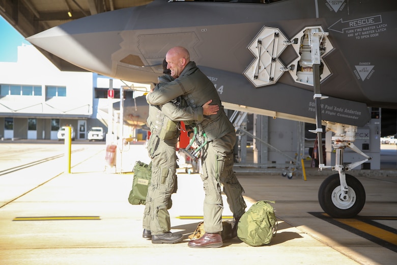 U.S. Marine Corps Lt. Col. Robert Guyette, right, an F-35B Lightning II pilot and commanding officer of Marine Fighter Attack Squadron (VMFA) 214, Marine Aircraft Group 13, 3rd Marine Aircraft Wing and Royal Australian Air Force Wing Commander Andrew Nelson, wing commander of the RAAF No. 75 Squadron, celebrate after completing a successful bilateral training flight at RAAF Base Tindal, Northern Territory, Australia, June 20, 2024. Leaders with VMFA-214, a USMC F-35B squadron, flew the RAAF F-35A during bilateral training, exhibiting interchangeability between RAAF and U.S. Marine aviation.  VMFA-214 deployed more than 200 Marines and eight F-35B Lightning II aircraft from Marine Corps Air Station Yuma, Arizona, to RAAF Base Tindal, Australia, to conduct bilateral training with the RAAF No. 3 Squadron and No. 75 Squadron. (U.S. Marine Corps photo by Cpl. Nicholas Johnson)