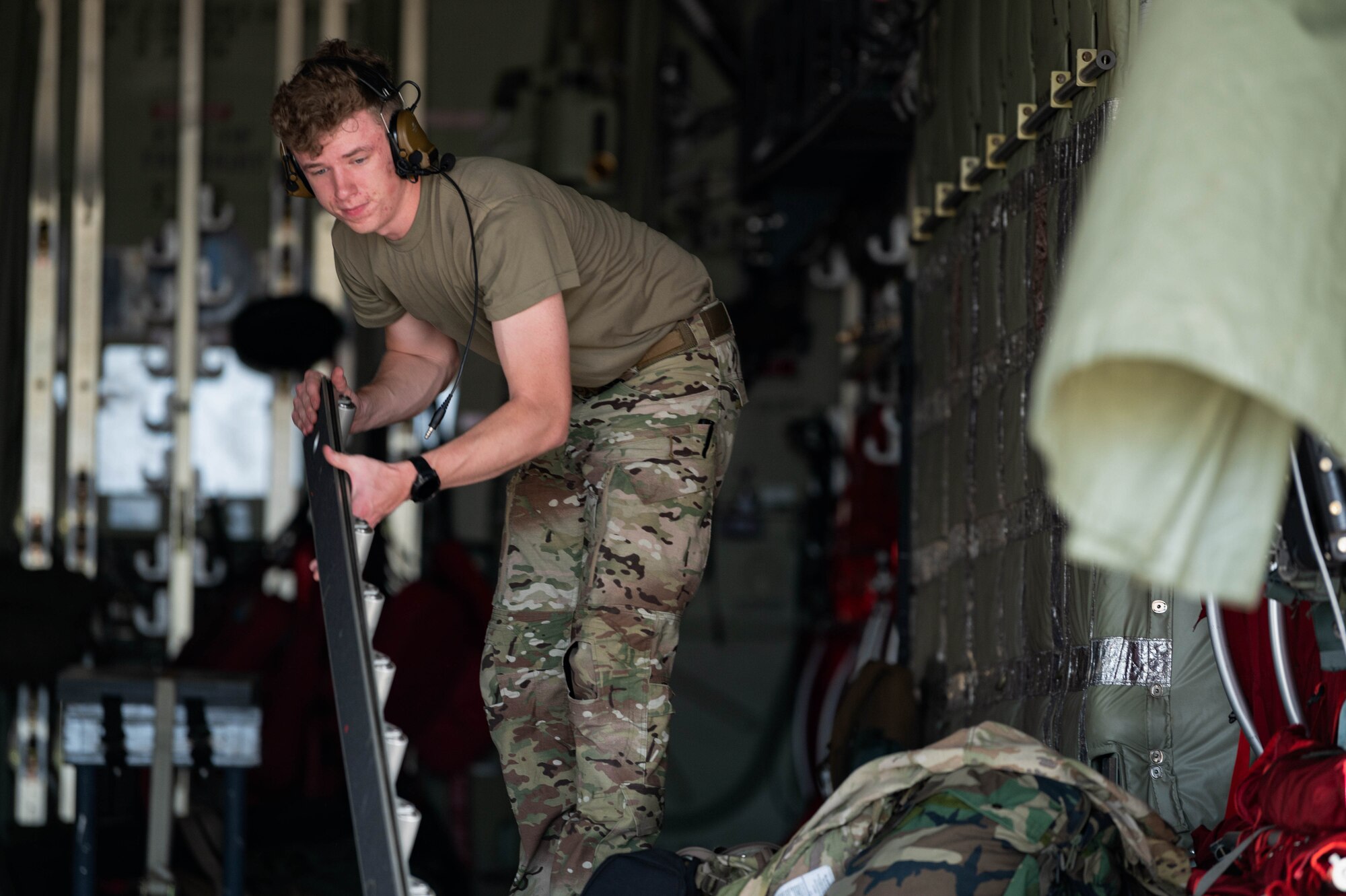 U.S. Air Force Senior Airman Zachary Thies, a 15th Special Operations Squadron special missions aviator, performs pre-flight procedures on an MC-130J Commando II Florida, June 6, 2024 before participating in the Spirit of St. Louis Air Show.
