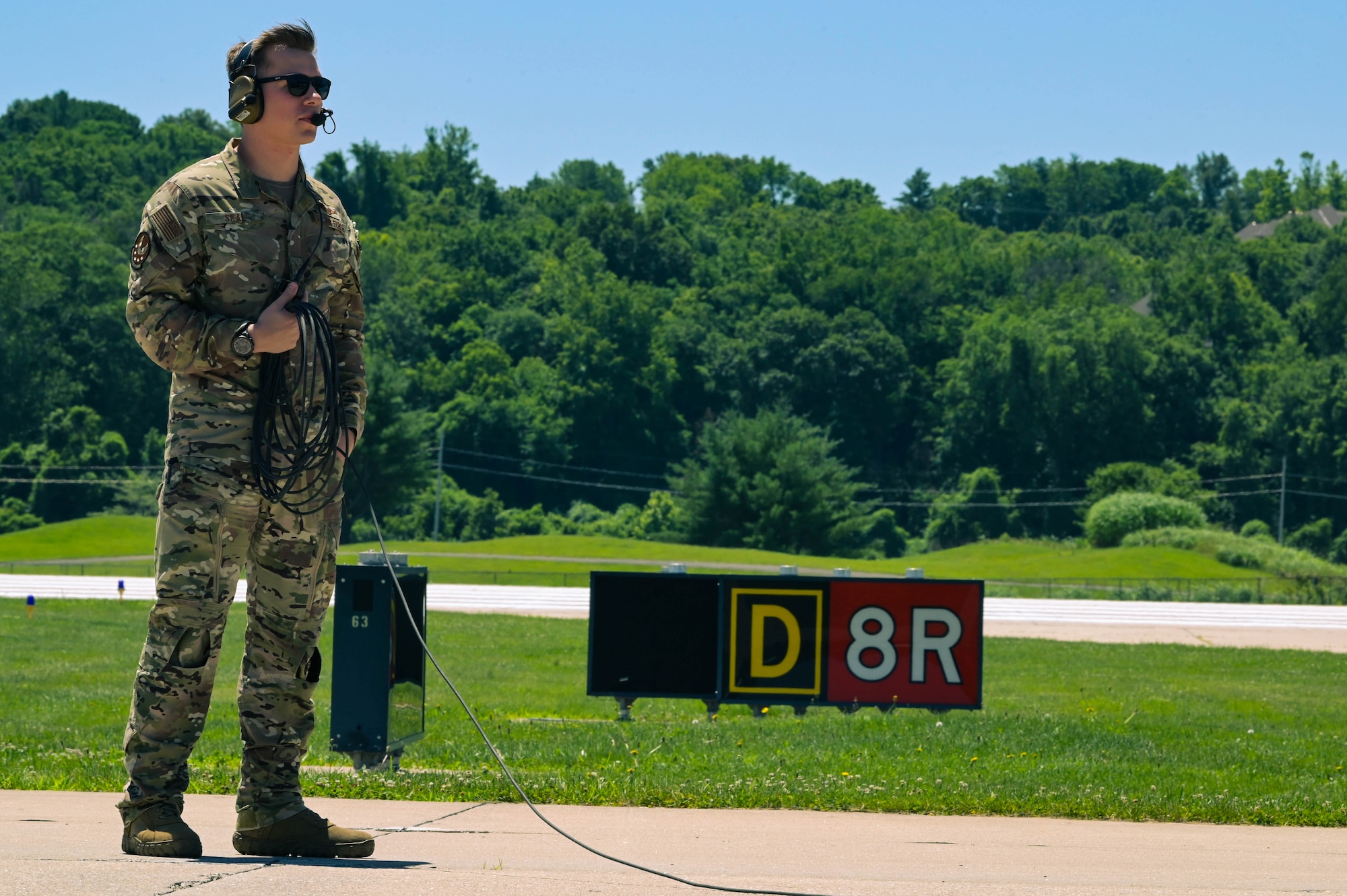 U.S. Air Force Matthew Seal, a 15th Special Operations Squadron special missions aviator, performs pre-flight procedures for an MC-130J Commando II during the Spirit of St. Louis Air Show at  St. Louis Lambert International Airport, Missouri, June 8, 2024.