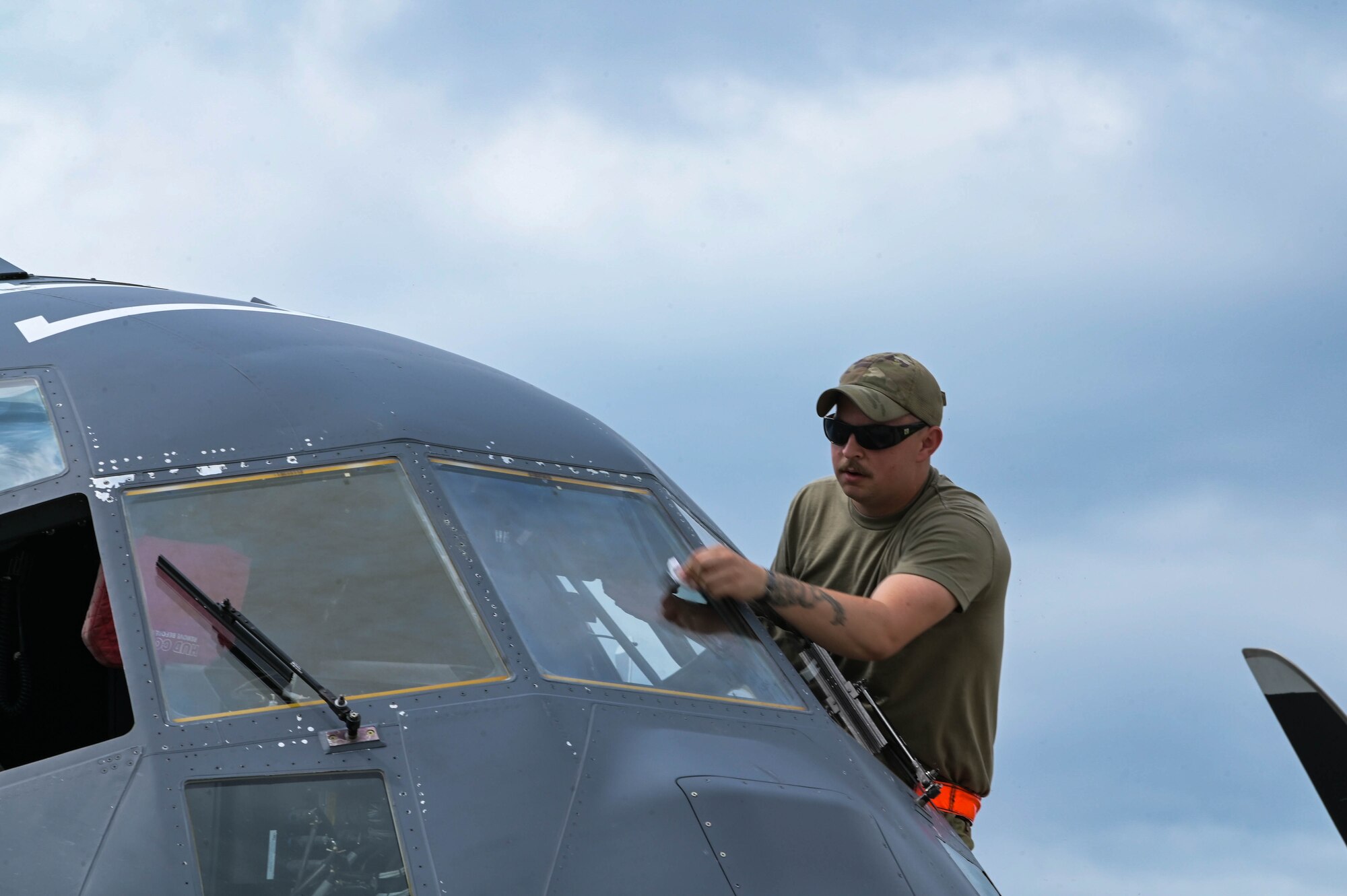 U.S. Air Force Staff Sgt. Robert Looper, a 15th Special Operations Maintenance Squadron crew chief, performs pre-flight procedures during the Spirit of St. Louis Air Show at  St. Louis Lambert International Airport, Missouri, June 8, 2024.