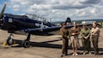 World War II re-enactors stand next to a North American Aviation T-6 Texan on static display at the 75th Anniversary of the Berlin Airlift, held at Wiesbaden Army Airfield, June 15-17, 2024.