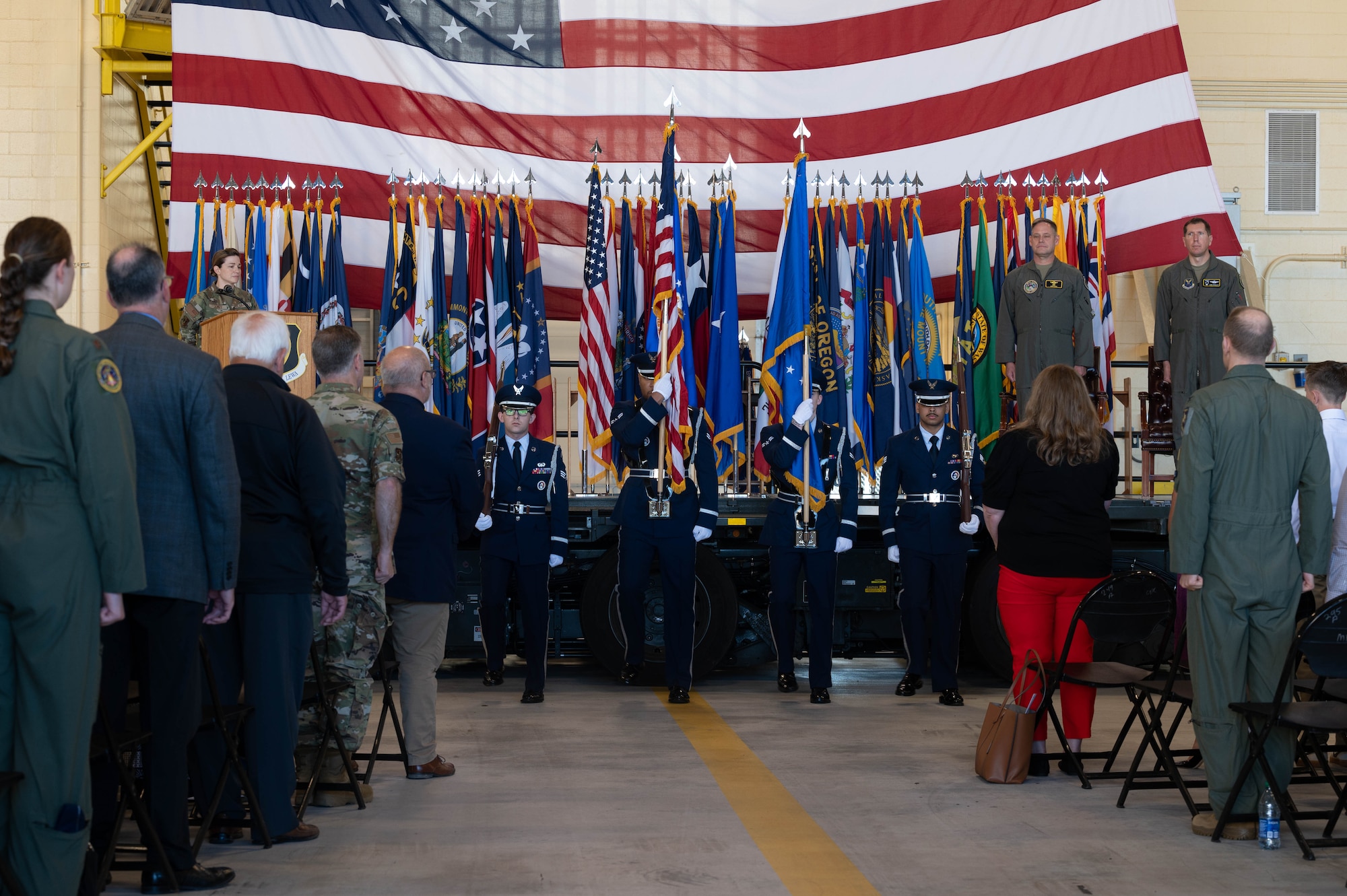 Minot Air Force Base Honor Guardsmen display the  colors during the national anthem at Minot Air Force Base, North Dakota, June 28, 2024. The Minot AFB Honor Guard serves a distinct mission under unique conditions from performing military honors around North Dakota to presenting colors on base. (U.S. Air Force photo by Airman 1st Class Luis Gomez)