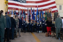 Minot Air Force Base Honor Guardsmen display the  colors during the national anthem at Minot Air Force Base, North Dakota, June 28, 2024. The Minot AFB Honor Guard serves a distinct mission under unique conditions from performing military honors around North Dakota to presenting colors on base. (U.S. Air Force photo by Airman 1st Class Luis Gomez)