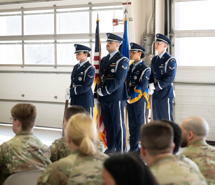 Minot Air Force Base Honor Guardsmen await their cue to present the colors during a retirement ceremony at Minot Air Force Base, North Dakota, July 3, 2024. The U.S. Air Force Honor Guard’s vision is to promote the Air Force mission, preserve their heritage and protect their standards and image. (U.S. Air Force photo by Airman 1st Class Luis Gomez)